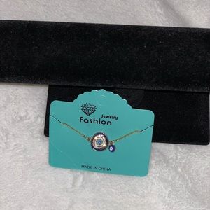 Goldtone evil eye adjusting bracelet